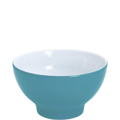 Eine runde Schüssel aus Keramik mit einem türkisfarbenen Äußeren und einem weißen Inneren. Die Schüssel hat eine sanfte, geschwungene Form und einen stabilen, leicht erhöhten Boden. Sie eignet sich ideal für Salate, Snacks oder Desserts und vermittelt einen modernen und frischen Look in jeder Küche.