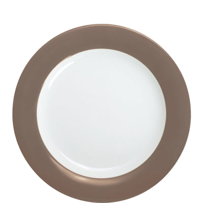 Ein runder Teller mit einem schlichten, weißen Innenbereich und einem braunen Rand. Der Teller ist flach und hat eine glatte Oberfläche, die für den Einsatz bei Mahlzeiten geeignet ist. Der Kontrast zwischen dem weißen und braunen Teil sorgt für eine ansprechende Ästhetik.