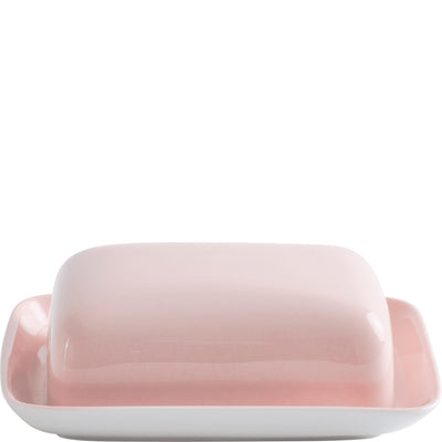 Ein rechteckiges Buttergeschirr mit einem sanften, rosa Deckel und einem weißen Unterteil. Das Design ist modern und minimalistisch, ideal für die Präsentation von Butter. Die Oberseite des Deckels ist glatt und glänzend, während das Unterteil eine saubere, matte Oberfläche hat.
