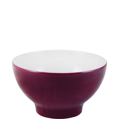 Eine schlichte, runde Schüssel mit einem tiefen, burgunderroten Äußeren und einer weißen Innenseite. Die Schüssel hat eine breite Öffnung und einen stabilen, leicht gewölbten Boden. Sie eignet sich ideal für Salate, Snacks oder Desserts und ist ein sowohl funktionales als auch ästhetisches Küchenutensil.