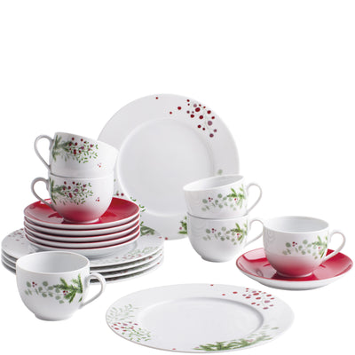 Haufen von Geschirr in verschiedenen Formen und Größen auf einem neutralen Hintergrund. Oben stehen mehrere Tassen mit einem roten Rand und buntem Blattdesign. Darunter stapeln sich Teller in verschiedenen Größen, einschließlich flacher und tiefer Teller, die ebenfalls mit einem floralen Muster dekoriert sind. Einige Teller haben einen schlicht weißen Hintergrund. Die Anordnung vermittelt eine festliche Atmosphäre, ideal für besondere Anlässe.