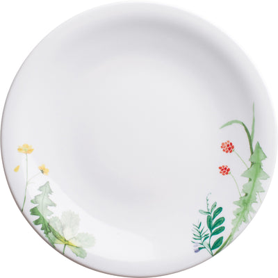 Ein flacher, runder Teller aus weißem Porzellan, dekoriert mit zarten Aquarellmotiven von grünen Pflanzen und bunten Blumen. Die florale Gestaltung befindet sich am Rand des Tellers und zeigt unterschiedliche Blatt- und Blütenformen in sanften Farben. Der Teller hat eine klare, glatte Oberfläche und eignet sich gut für Servieren oder Dekoration.