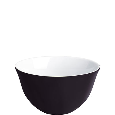 Eine runde Schüssel mit einer Außenfarbe in mattem Schwarz und einer weißen Innenfläche. Die Schüssel hat eine glatte Oberfläche und eine gleichmäßige Form, ohne Dekoration oder Muster. Sie steht auf einer flachen Unterlage und wirkt modern und minimalistisch.