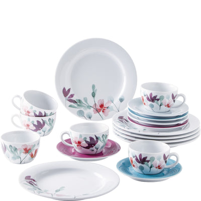 Set aus Geschirr mit buntem Blumendesign. Es umfasst vier Tassen mit Untertassen, zwei große flache Teller und mehrere kleine Teller in verschiedenen Farben. Die Tassen zeigen zarte Blumendekore in Rosa und Blau, während die Teller abwechselnd mit floralen Mustern und einfarbigen Designs gestaltet sind. Das Geschirr hat eine elegante, zeitgemäße Form und ist hauptsächlich in Weiß gehalten.